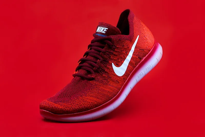 Nike sneaker on red background